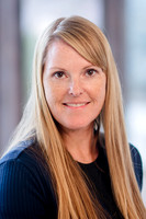 A cinematic shot of Stephanie Morgan, a real estate professional, standing elegantly in a beautifully renovated home, captured by Brian Smyer and Smyer Image