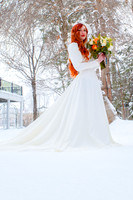 Stunning red hair on a fair skinned bride in the snow at the Woods on Ninth, Utah