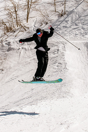 Groom on k2 pow skis mid air