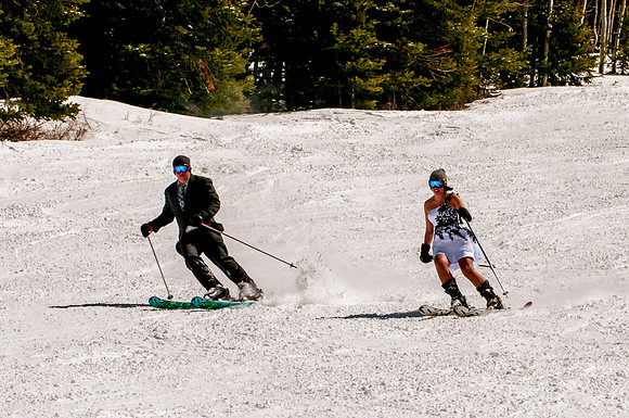 Bride and groom skiing