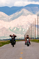 Groom rides a wheely on Harley motorcycle
