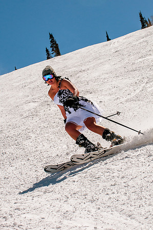 Bride in wedding dress skiing