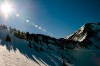 Sun flare over mountain top.  Snowbird, Utah