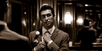 Snowbasin Wedding Inspiration groom getting ready in mirror