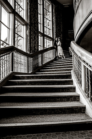 Snowbasin Wedding Inspiration-Bride and groom pose on beautiful staircase.