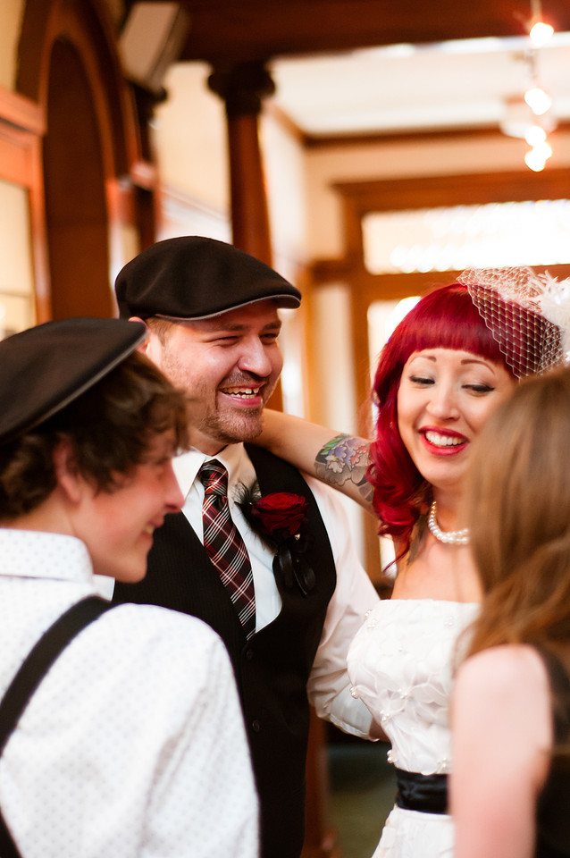 Emotional candid moment of bride, groom, son and daughter just after wedding ceremony