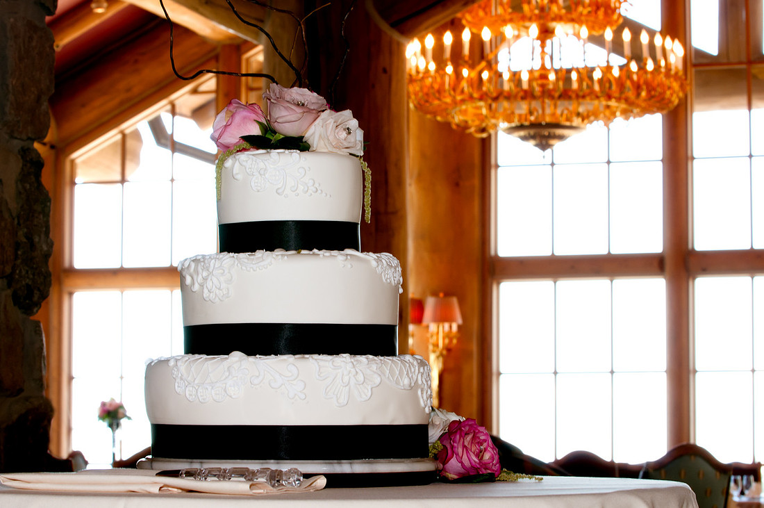 Snowbasin Wedding Inspiration-Wedding cake with chandelier in background