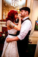 Bride wipes lipstick off groom's face after first married kiss