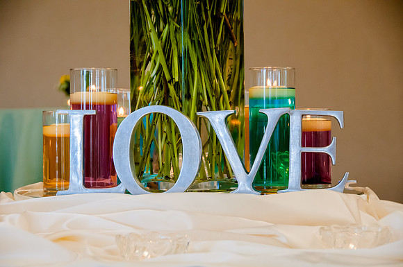 Love, wedding candles and vase