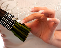 Close up detail shot of bride's nails, bride getting ready shirt and bling on her bouquet