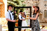 Kids framing Mom and Dad kissing.