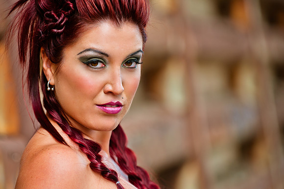 Gorgeous red haired bride stares into camera
