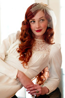 Vintage red head bride on a piano back lit with natural window light.