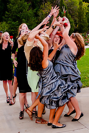 Girls fighting for bouquet at wedding