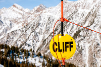 Cliff hazard sign with a cliff background at Snowbird
