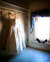 Vintage wedding dress shot in antique bathroom, high heels included.