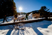 Snowshoeing at Snowbird.  Long shadows and sun burst.