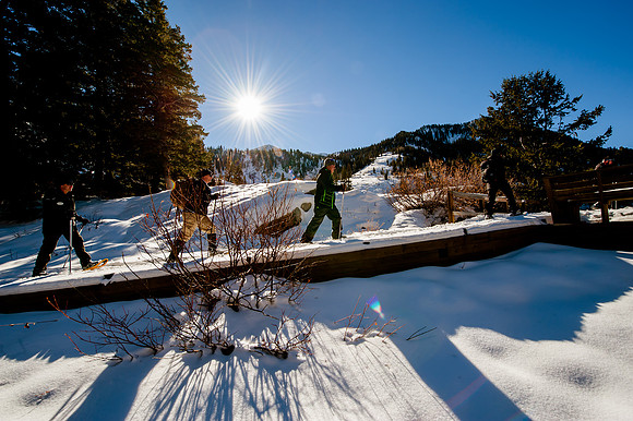 Snowshoeing at Snowbird.  Long shadows and sun burst.