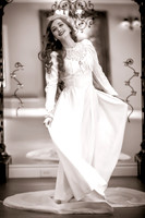 Black and white 40's inspired bride twirling her wedding dress in front of a mirror at the Woods on Ninth, Utah