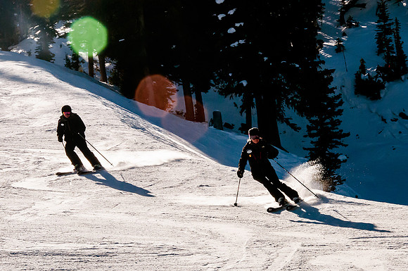 Wasatch adaptive sports staff Laura and Josh skiing Snowbird